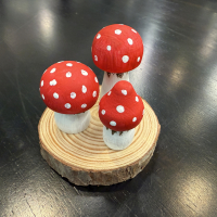 Miniature wooden mushrooms decorated with paint