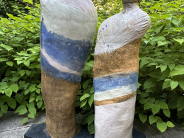 a sculpture of two human figures