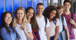 Teens leaning against lockers