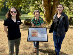 Margaux Meganck, author/illustrator of People Are Wild at the  StoryWalk with library staff