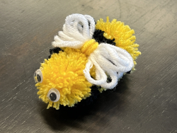 a bee craft made out of yarn