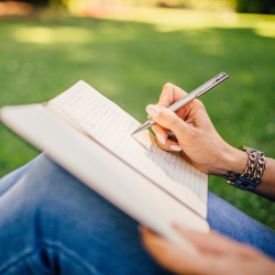 woman writing in a notebook
