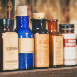 a collection of vintage bottles on a shelf