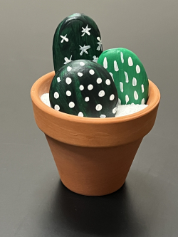 rocks painted to look like cactus in a pot